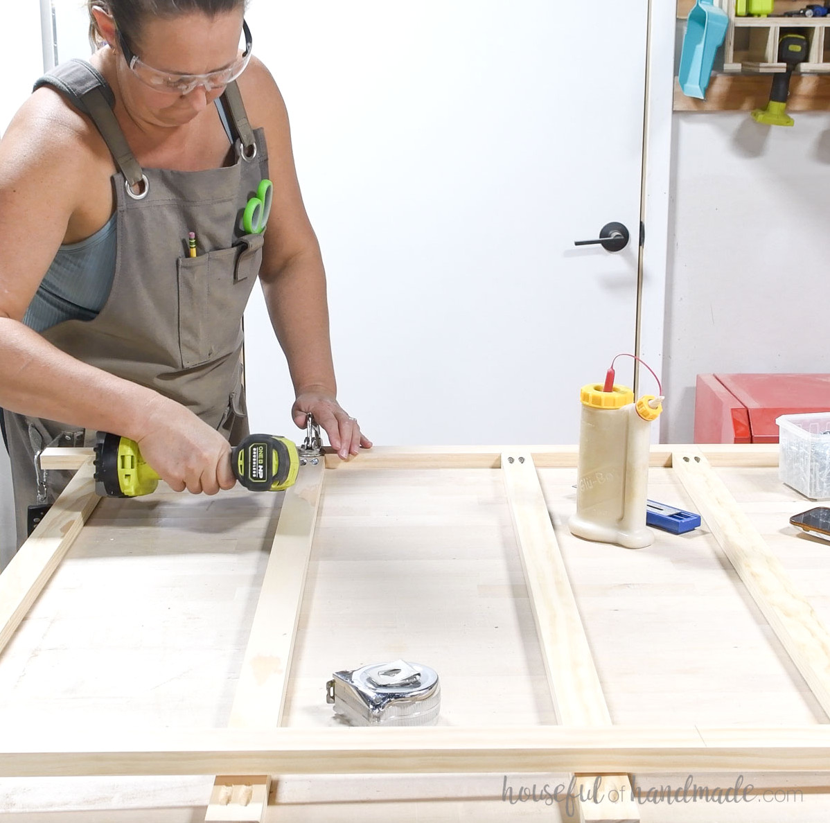 Constructing a face frame around the storage cabinet drawers.