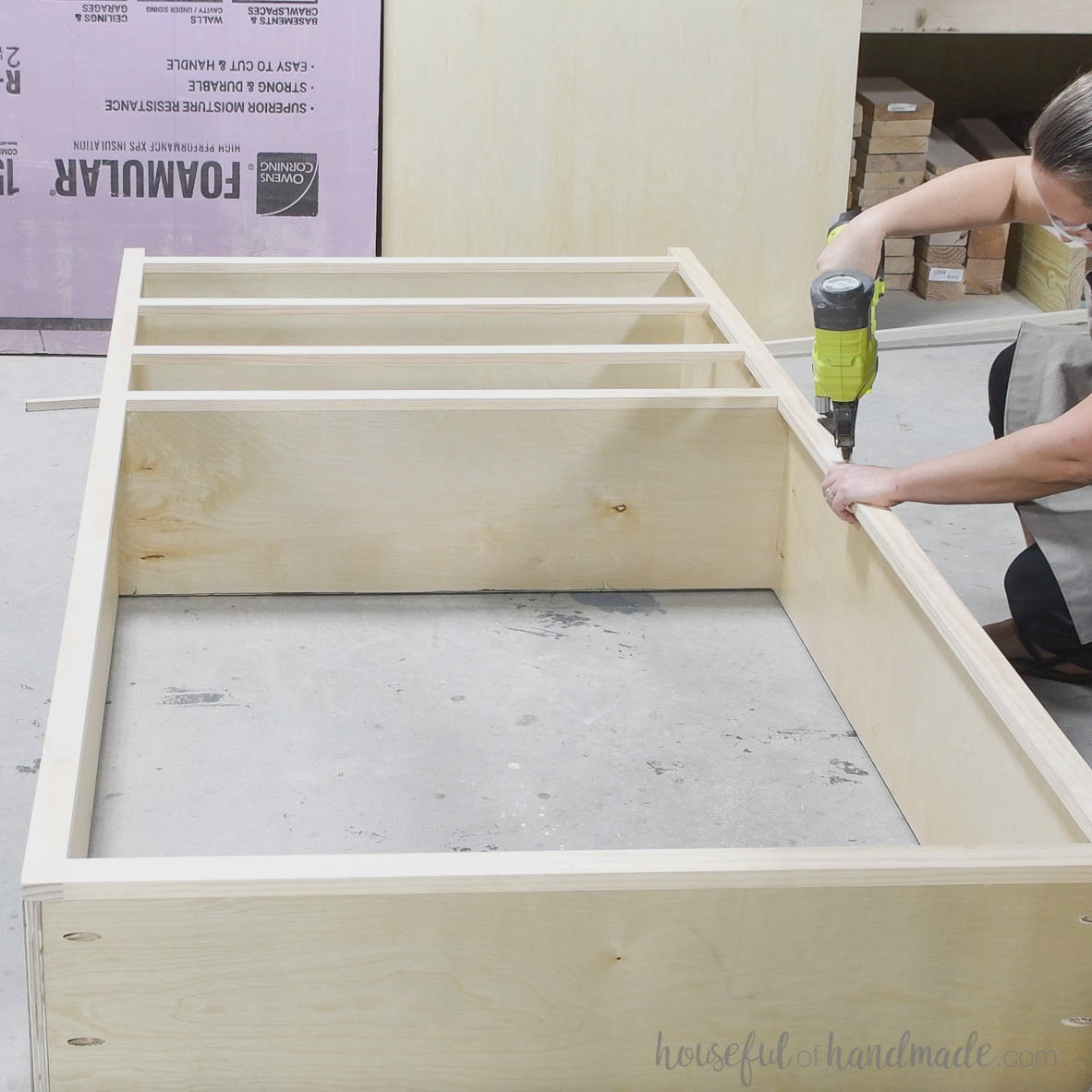 Fastening the face frame with brad nails.