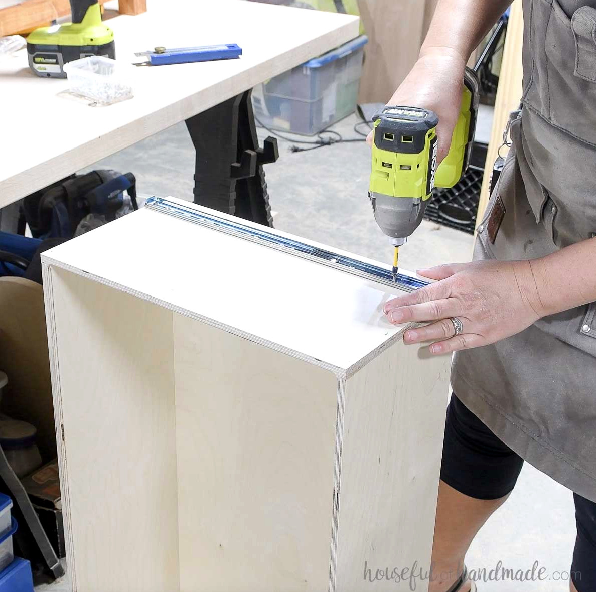 Securing the drawer slide component to the drawer box.