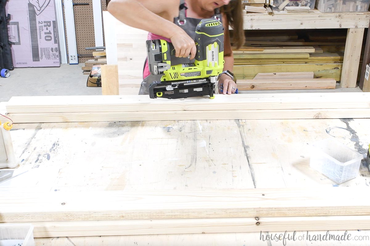 Attaching the rail support to the bed rails with finish nails before adding screws.