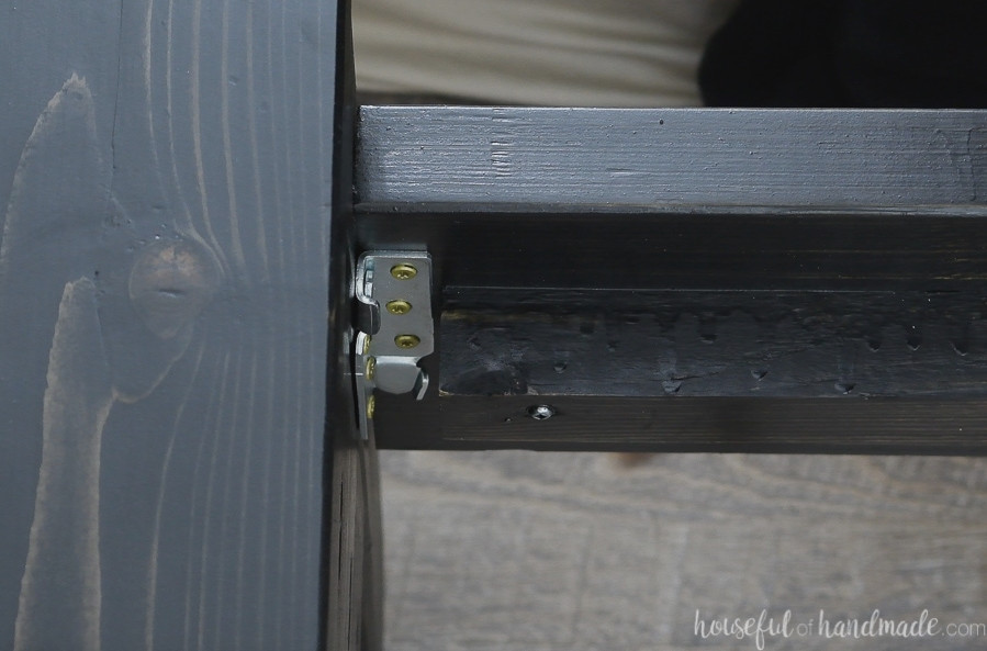 Detailed view of the bed rails secured with bed rail brackets. 
