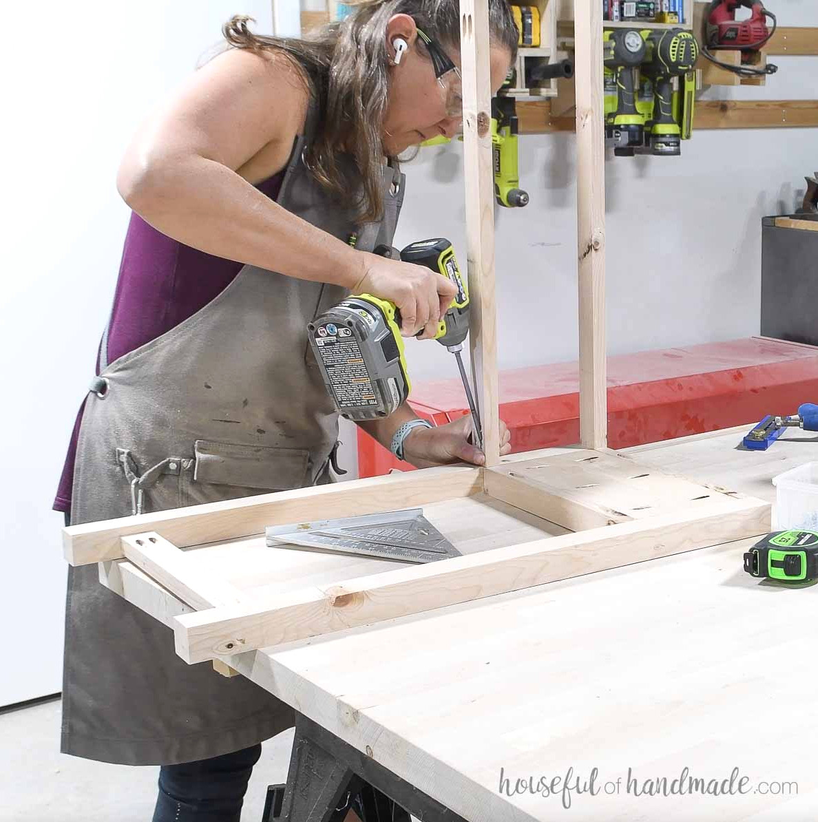 Securing two center rails to an assembled side piece.