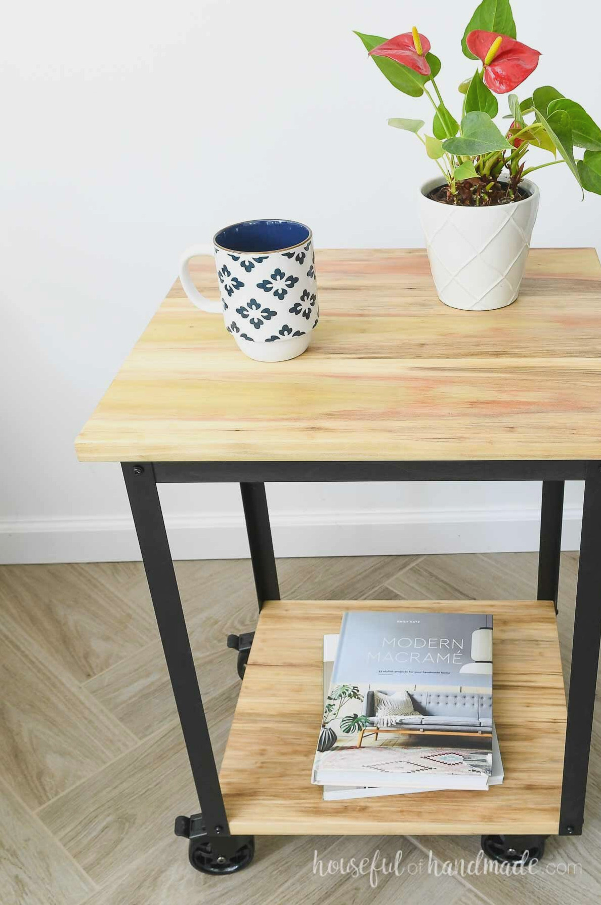 Poplar side table with colorful grain and black metal legs.