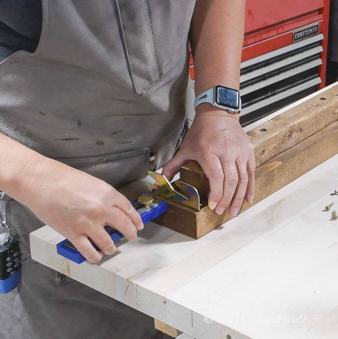 Lining up the bracket on the side rails.
