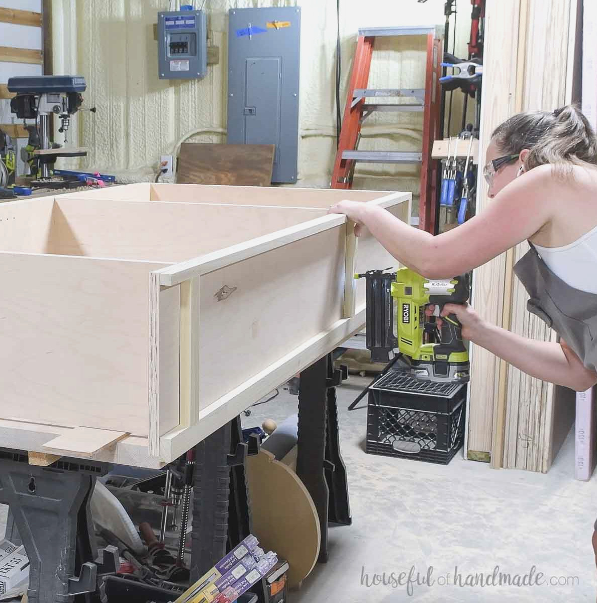 Securing the side frame trim to the bookcase. 