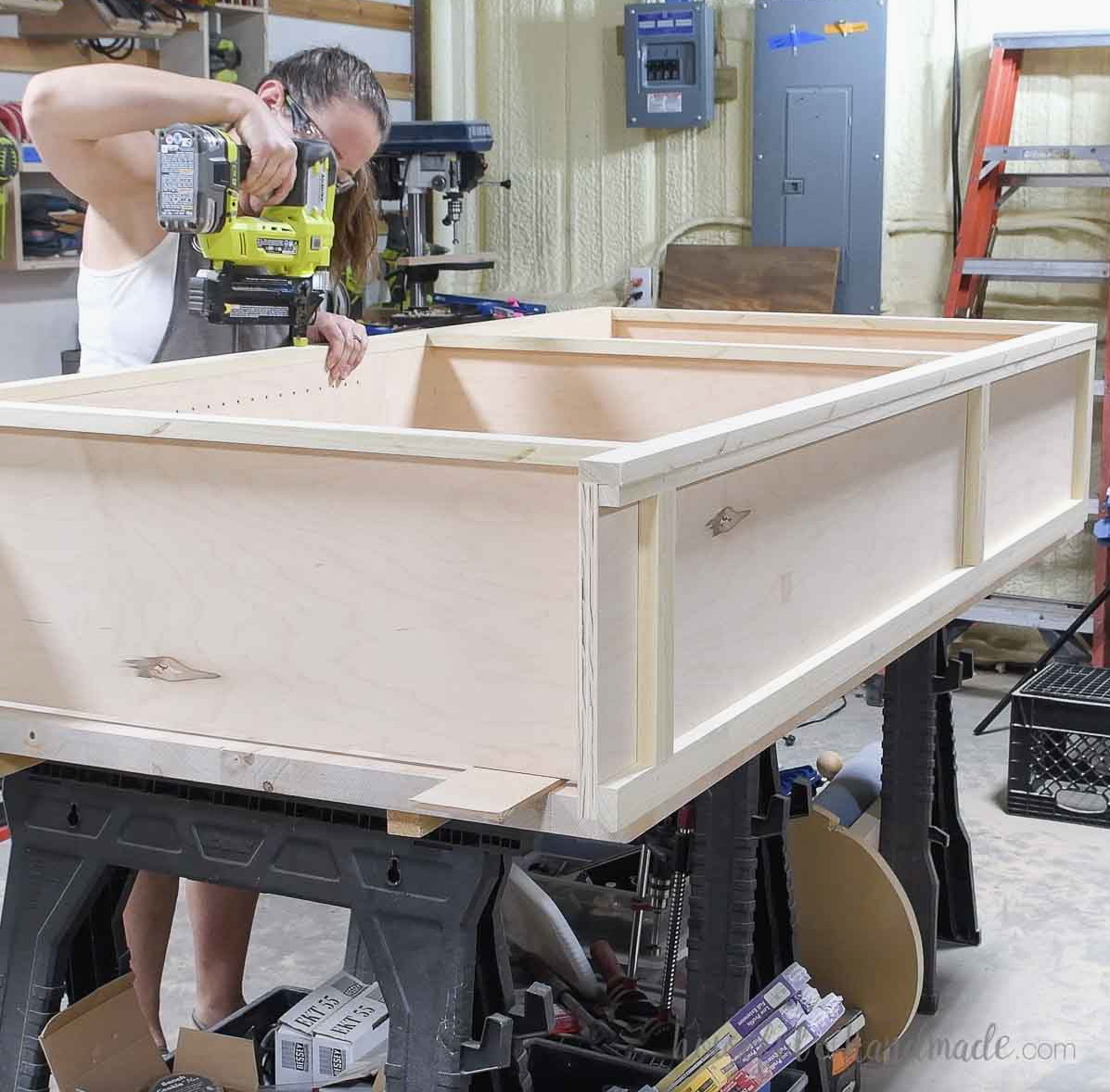 Securing the face frame to the bookcase front. 