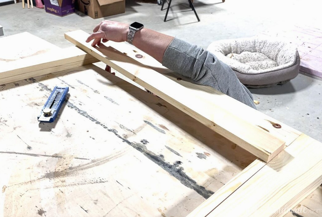 Checking the front skirt trim piece against the top of the assembled section.