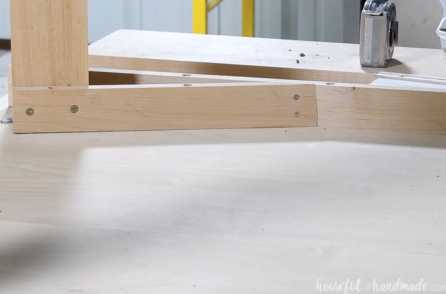 The interior skirt secured to the leg and skirt board.