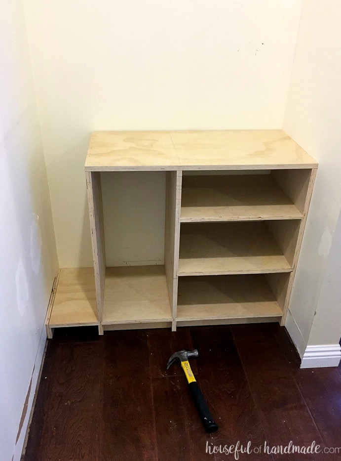 Assembled cabinet and toe kick test fitted on the other side of the walk-in closet.