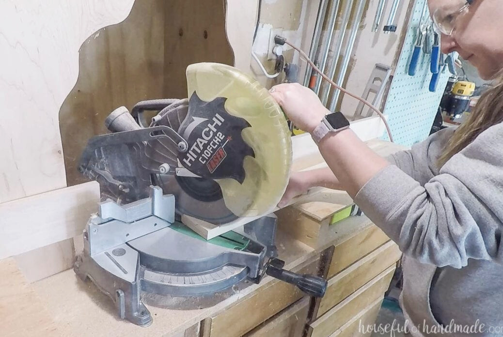 Cutting the angled bench legs with a miter saw.