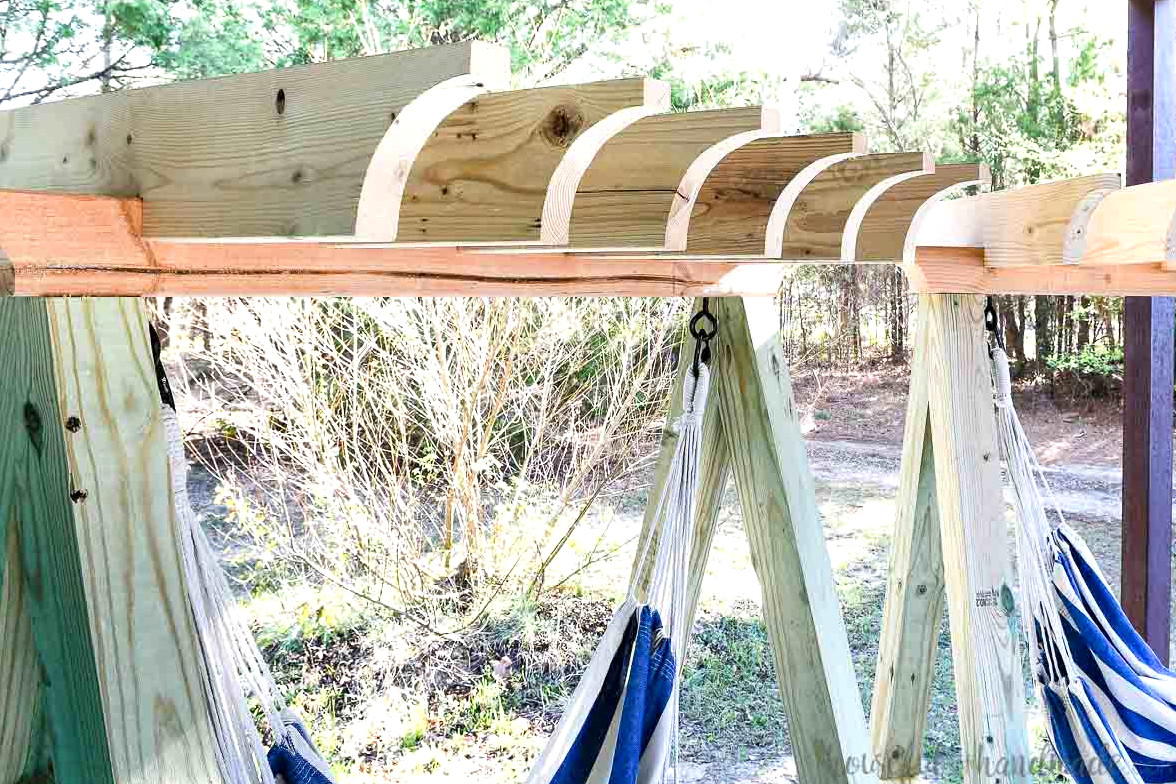 Detailed view of the pergola rafters positioned above the hammock swing stand. 
