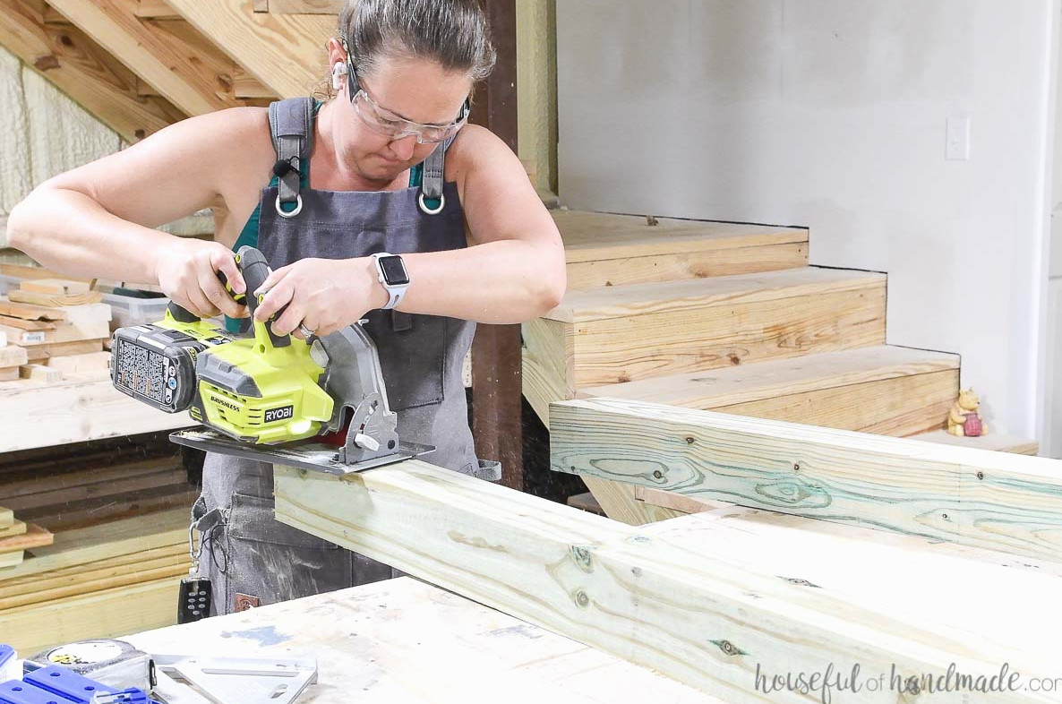 Cutting the extended angle on top of the 4x4 board with a circular saw. 