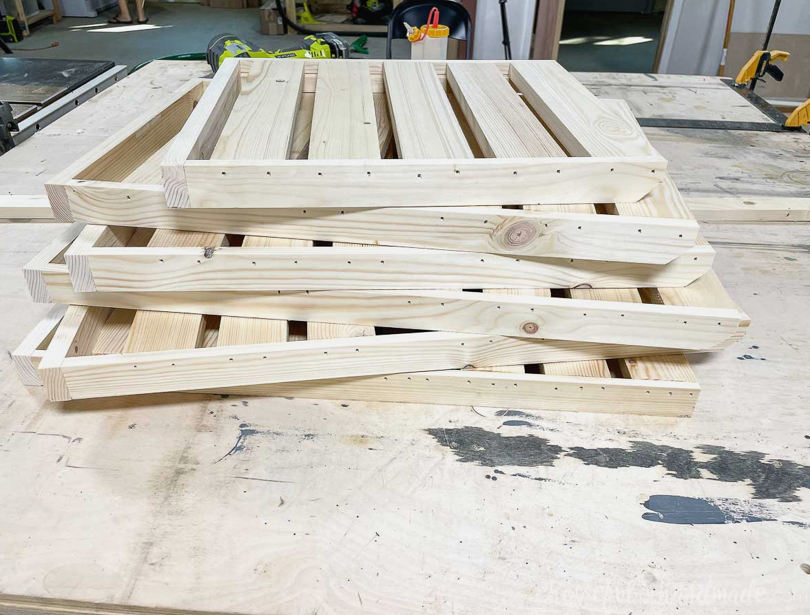 All assembled plant shelves for the stand stacked together. 