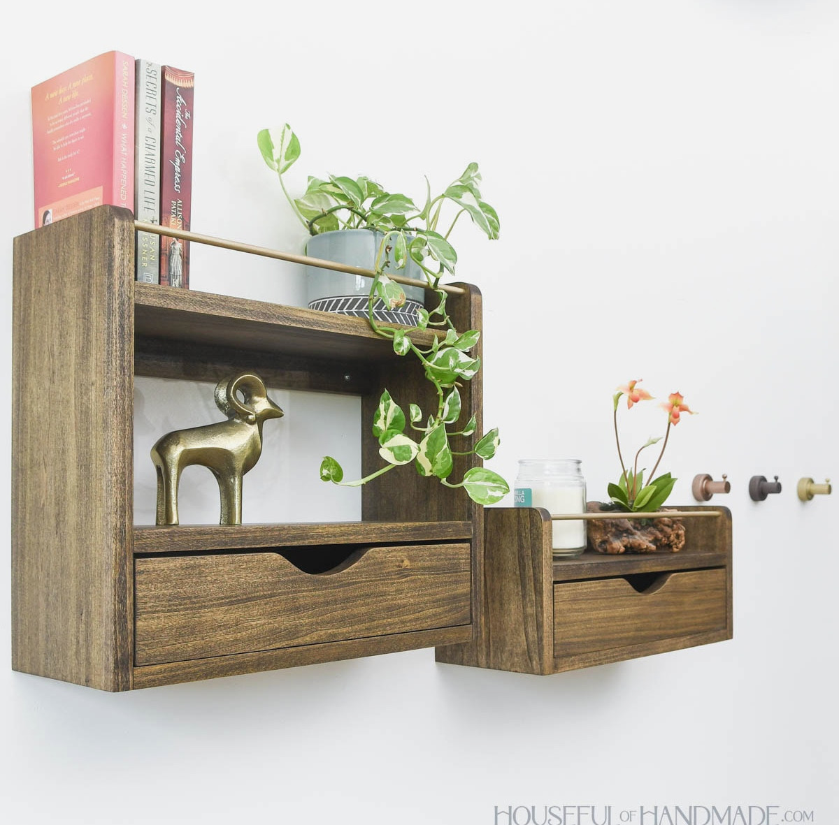Wooden wall shelves with drawers stained dark walnut. 