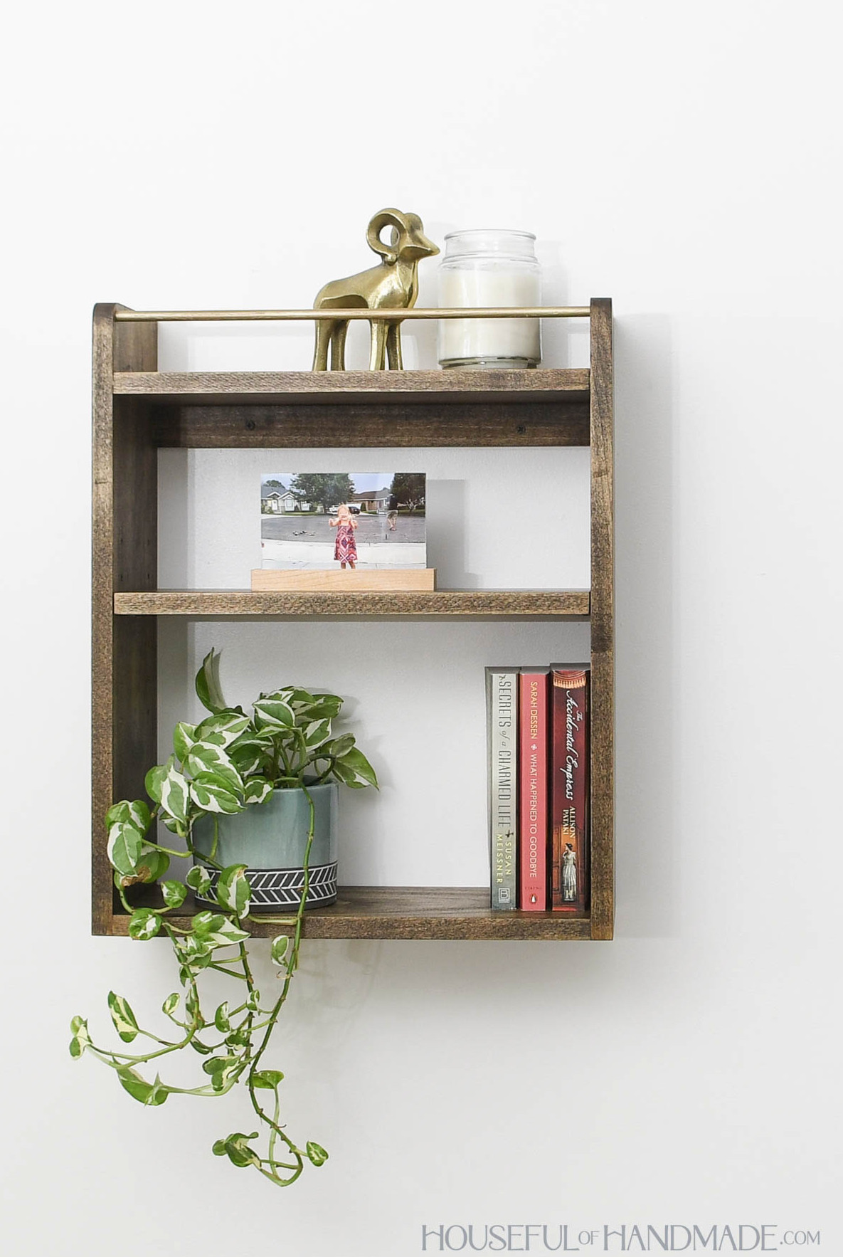 DIY wall shelf with an adjustable center shelf and rail on the top. 