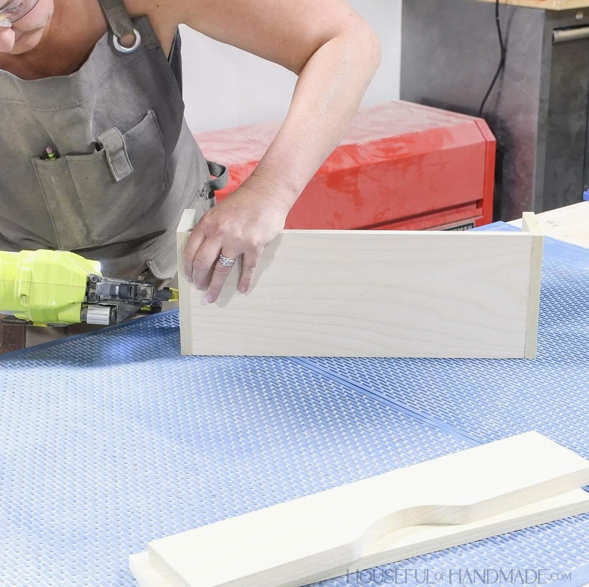 Nailing the sides of the drawers to the bottom. 
