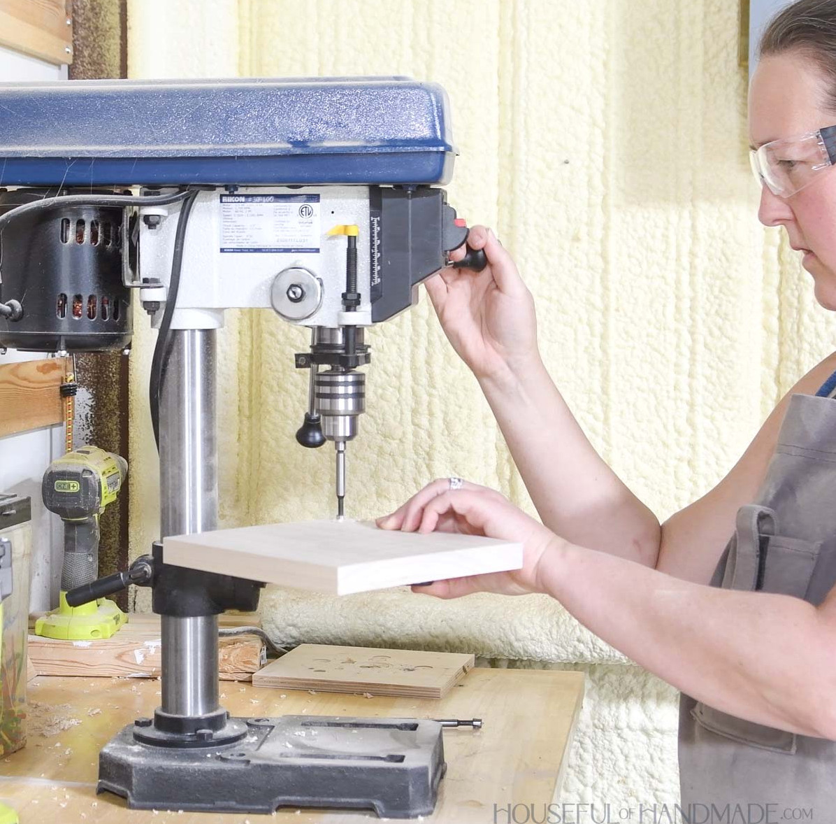 Drilling a hole on a drill press. 