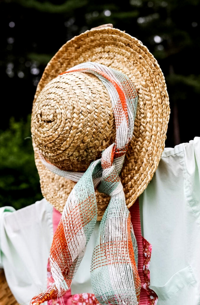 straw hat on a scarecrow