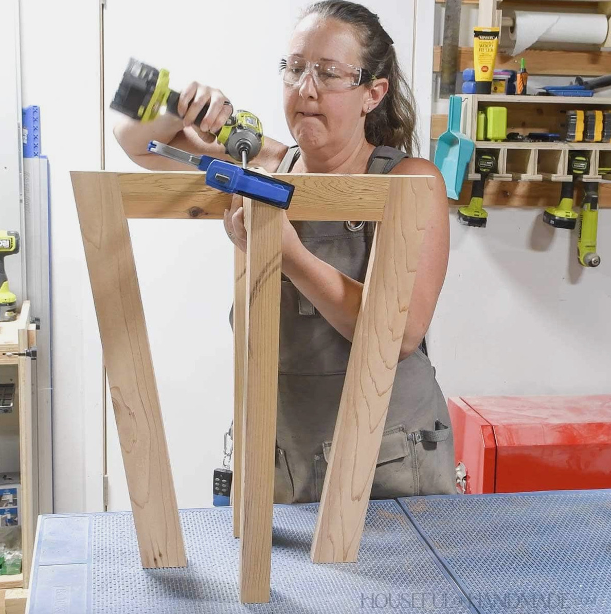 Attaching the legs together to create a pedestal.
