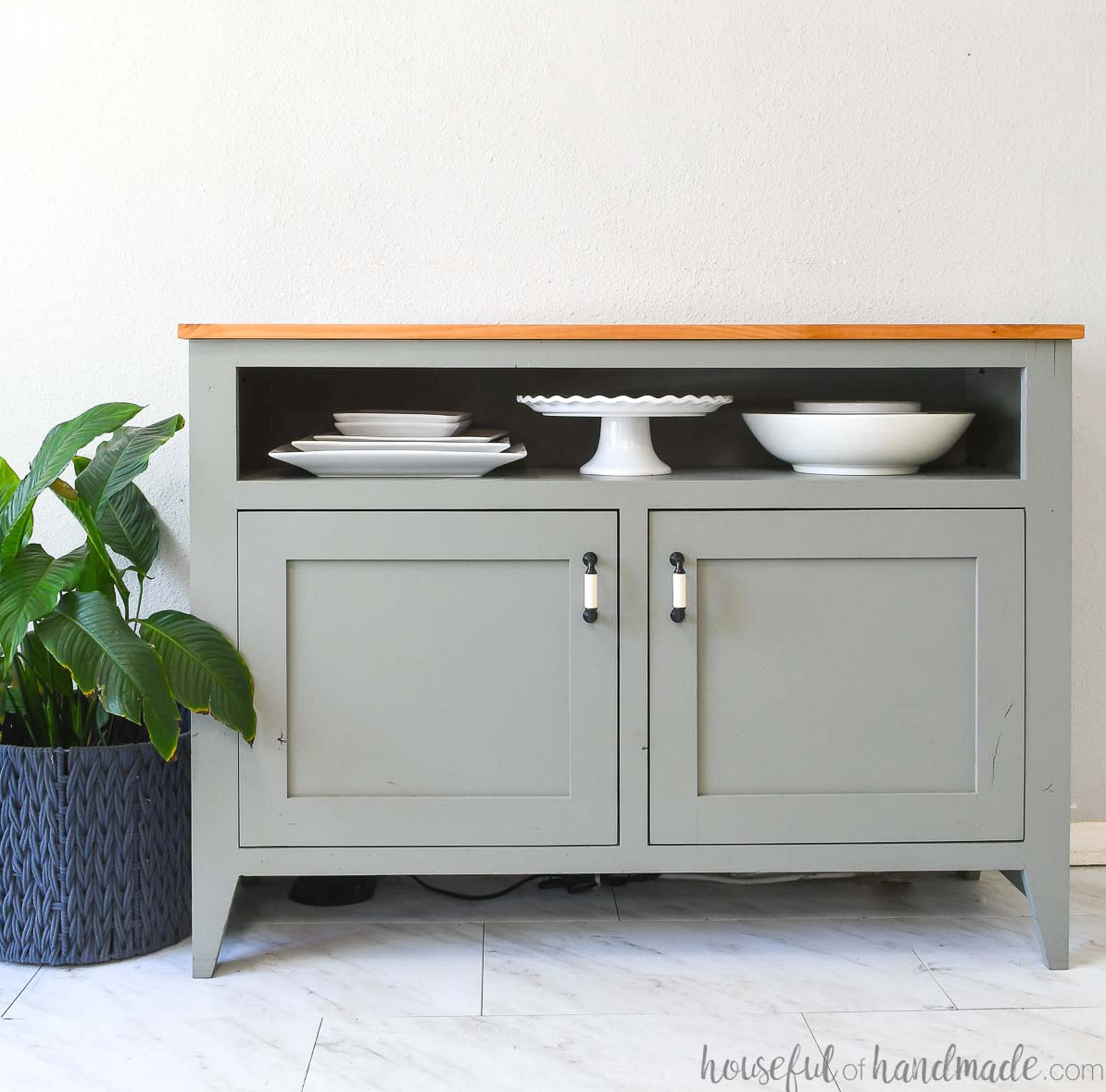 DIY sideboard table featuring two lower doors and an open upper shelf for serving dishes.