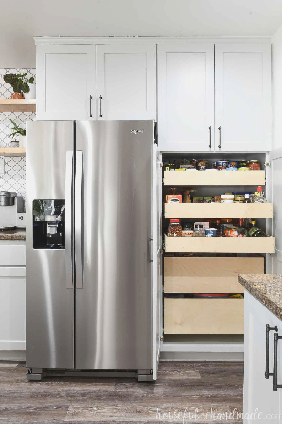 Pantry beside a refrigerator with both doors open, revealing DIY pull-out drawers.