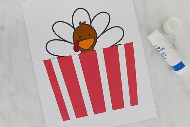 Attach the popcorn bag to the paper
