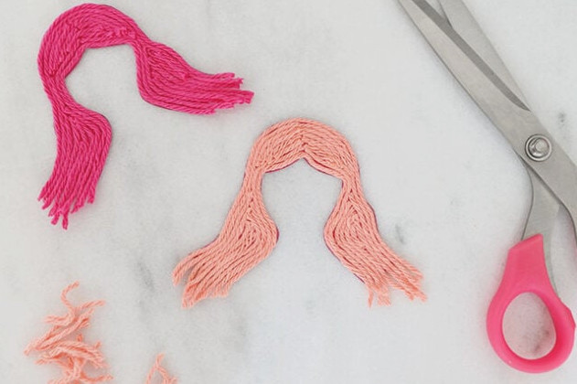 Trim excess yarn off hair