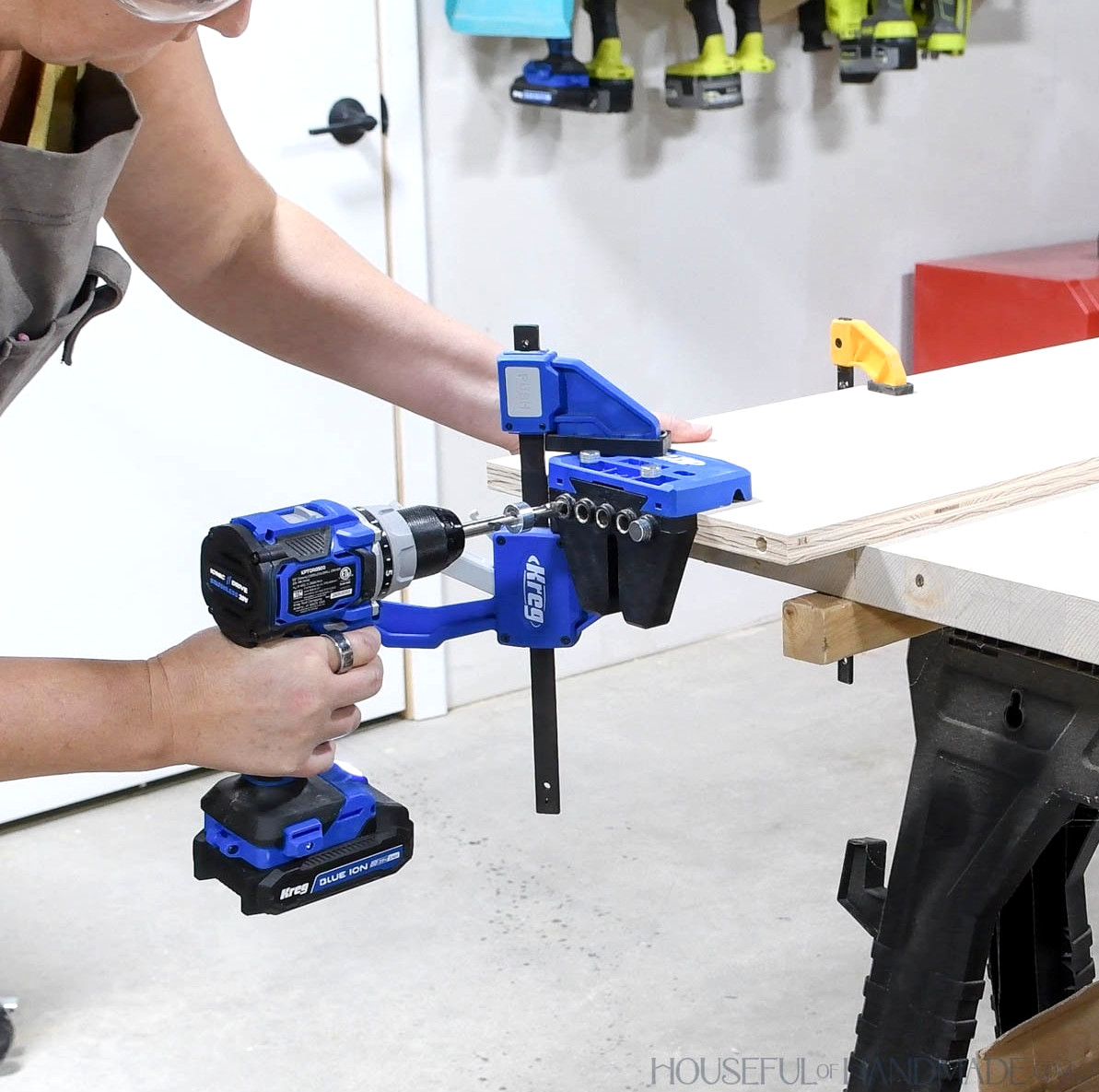 Drilling dowel holes in the edge of a board with the Kreg Dowel jig.