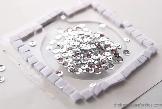 Placing Sequins in Grinch Card