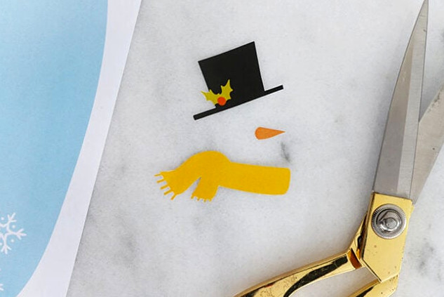 Trimming snowman paper features