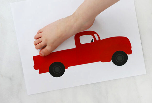 Foot pressing onto truck sheet