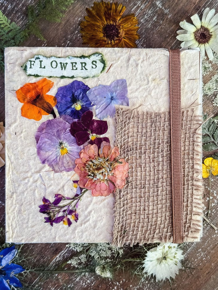 a journal cover decorated with genuine pressed flowers